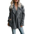 Woman wearing a cozy gray fur winter coat, showcasing stylish design and warm fabric, perfect for cold weather.