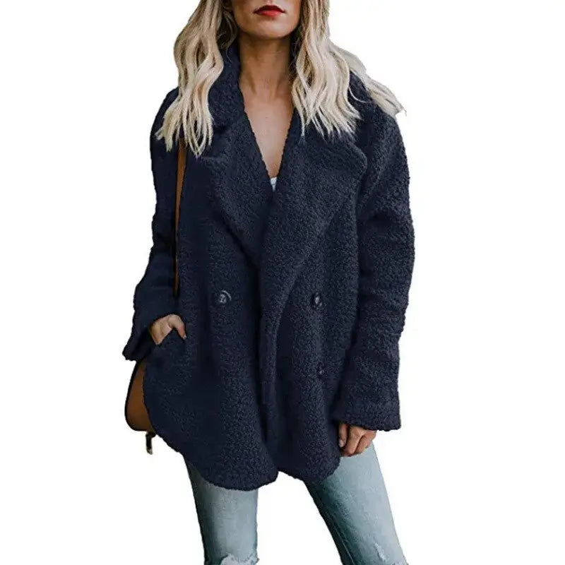 Stylish woman wearing a cozy navy fur winter coat with a relaxed fit, perfect for chilly weather.