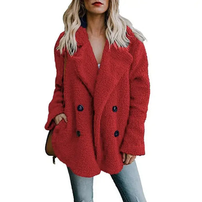 Woman wearing a stylish red fur winter coat, showcasing a cozy and chic look for the cold season.